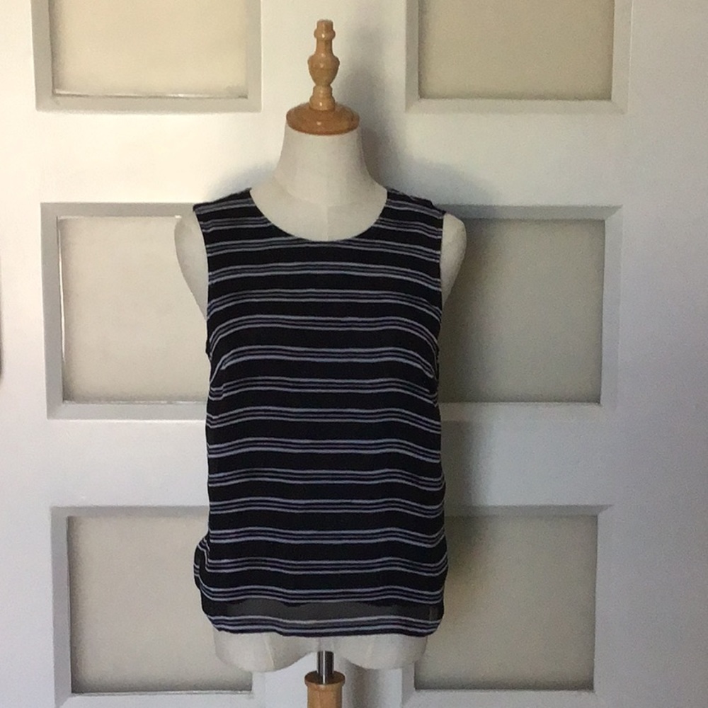 Black and white striped sleeveless shell.